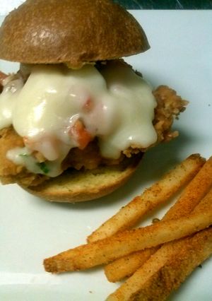 A picture of italian parm crusted slider and cajin fries.