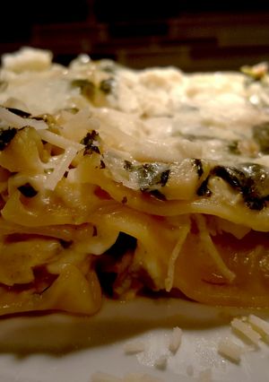 A picture of Spinach artichoke lasagna with chicken.