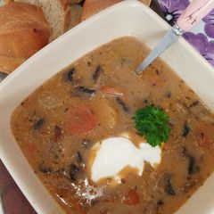 A picture of Not so creamy mushroom soup with vegetables.