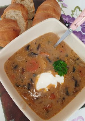 A picture of Not so creamy mushroom soup with vegetables.