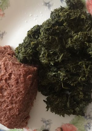 A picture of Kienyeji greens and brown ugali.