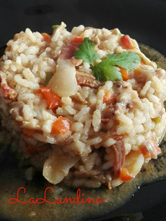 Una foto de Risotto de manitas, oreja y jamón