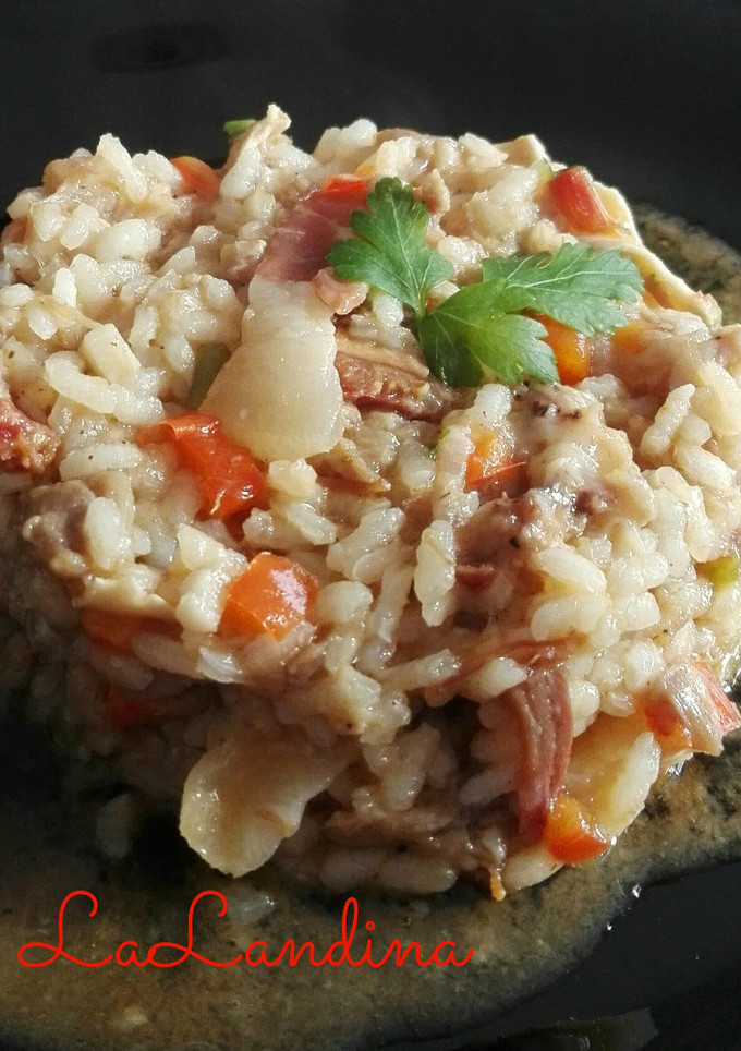 Una foto de Risotto de manitas, oreja y jamón