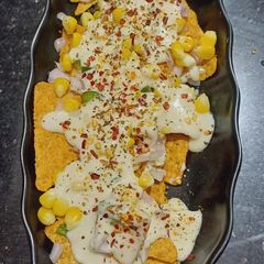 A picture of Vegetable cheesy nachos.