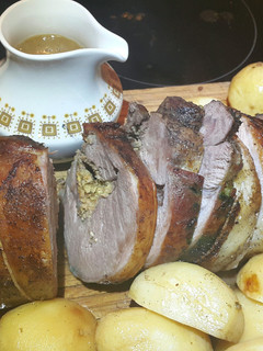 A picture of Stuffed Leg Lamb, roast potatoes & gravy..