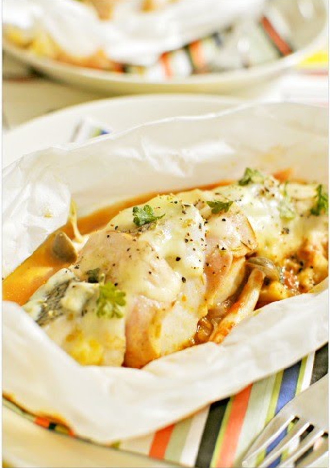 A picture of Steamed Cod Slices and Bacon with Tomato Sauce.
