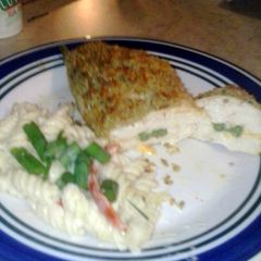 A picture of Asparagus and cheese stuffed chicken.