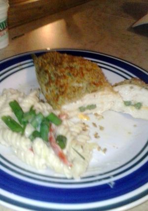 A picture of Asparagus and cheese stuffed chicken.