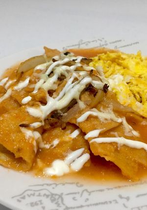 A picture of Chilaquiles with Red Sauce.