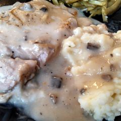 A picture of Tender cream of mushroom pork chops.