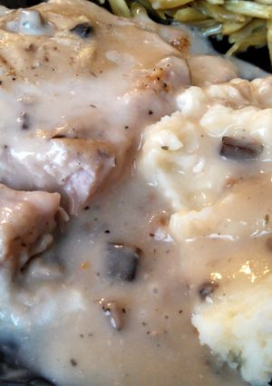 A picture of Tender cream of mushroom pork chops.