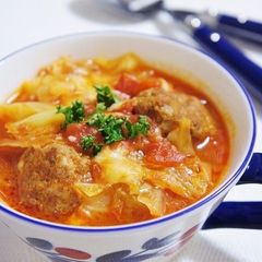 A picture of Meltingly Soft Cabbage and Meatballs Stewed in Tomatoes.