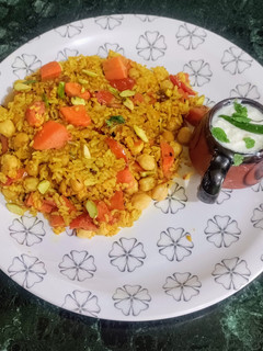 A picture of Carrot Khichdi with Curd masala Kadi.