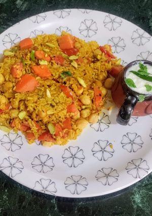 A picture of Carrot Khichdi with Curd masala Kadi.