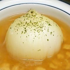 A picture of Chinese Soup with Ground Chicken and a Whole Onion.