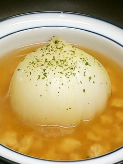 A picture of Chinese Soup with Ground Chicken and a Whole Onion.