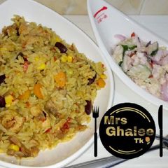 A picture of Fried rice with salad.