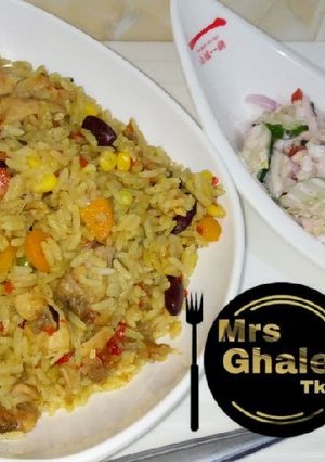 A picture of Fried rice with salad.