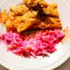Potato veggies stuff papad roll with salad A picture of Potato veggies stuff papad roll with salad.