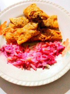 A picture of Potato veggies stuff papad roll with salad.