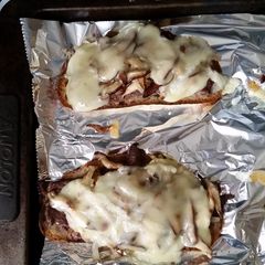A picture of Open-faced Philly Steak Sandwiches.