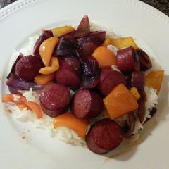A picture of Polish Sausages With Onions and Sweet Peppers.