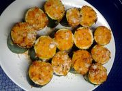 A picture of zucchini in the oven with cheeses