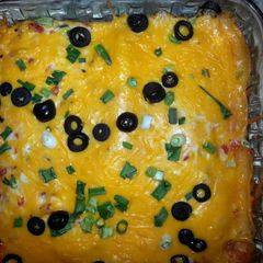 A picture of cheesy enchiladas.
