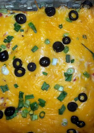 A picture of cheesy enchiladas.