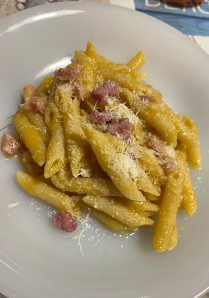 A picture of Pennette with Pancetta, Yellow Cherry Tomato Sauce, and Pecorino (Fake Carbonara).