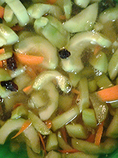 A picture of Cucumbers and carrots.