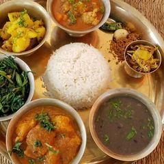 A picture of Dal Bhat (lentils with rice) (Nepal).