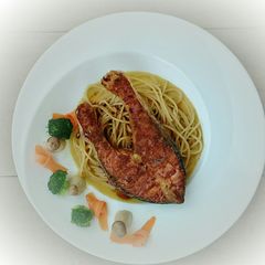 A picture of Salmon With Curried Butter And Spaghetti.