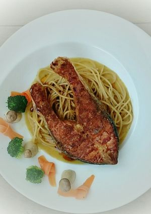 A picture of Salmon With Curried Butter And Spaghetti.