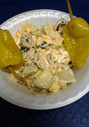 A picture of Egg avocado and olive salad.