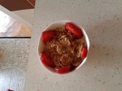 A picture of yogurt with banana and honey