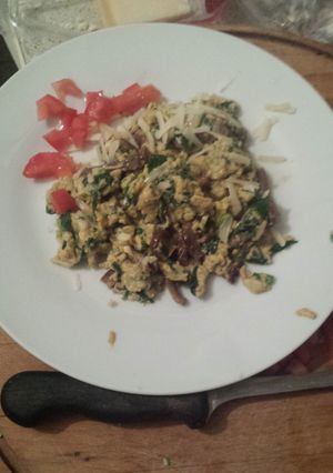 A picture of Eggs with Baby Spinach and Mushrooms.
