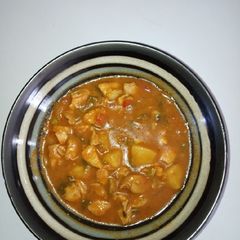 A picture of Boneless chicken and potato stew.