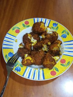 Una foto de Coliflor al horno, rebozada de especias