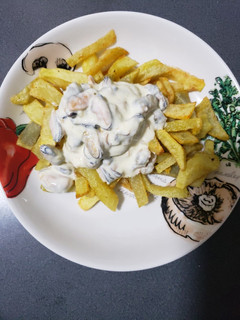 Una foto de Salsa de crema-queso con choritos