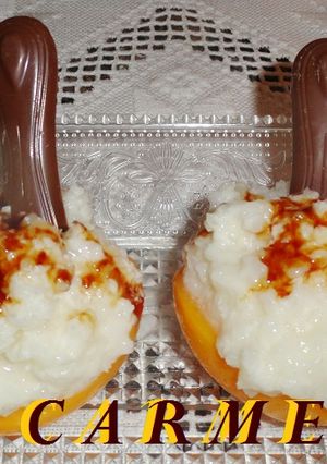 Foto principal de Melocotones rellenos de arroz con leche y coco