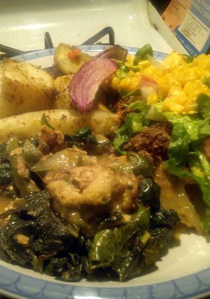 A picture of Sautéed catfish nuggets with spinach. and Green peppers.