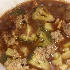 A picture of Cube steak and brocolli dish.