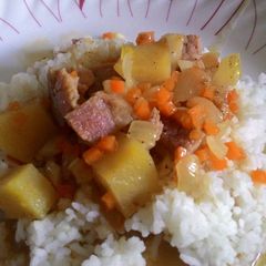 A picture of Leftover Ham with Cheese and Potatoes over rice.