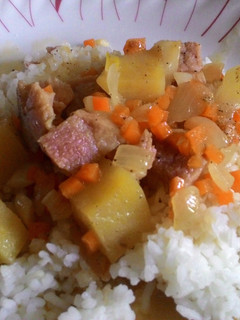 A picture of Leftover Ham with Cheese and Potatoes over rice.