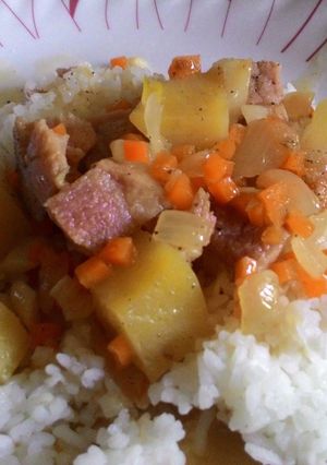 A picture of Leftover Ham with Cheese and Potatoes over rice.