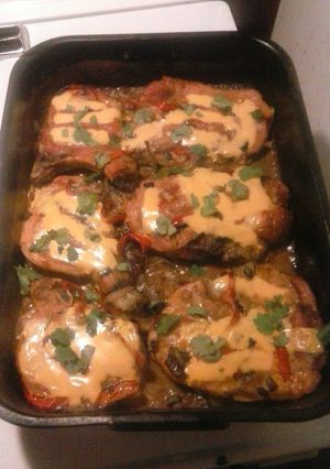 A picture of Mexican style smothered pork chops.