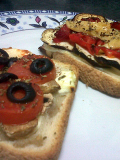 A picture of Toasts baked with cheese, tomato and eggplants.