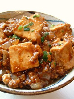 A picture of Mapo Tofu with Onions.