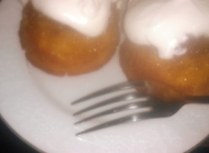A picture of Mini pineapple upside-down cakes w/homemade whipped cream.
